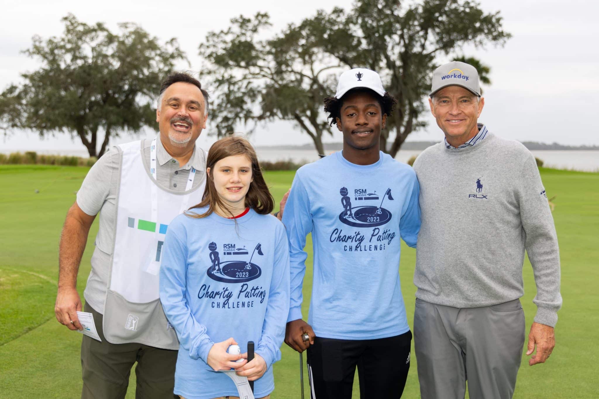Davis Love III et al. posing for the camera