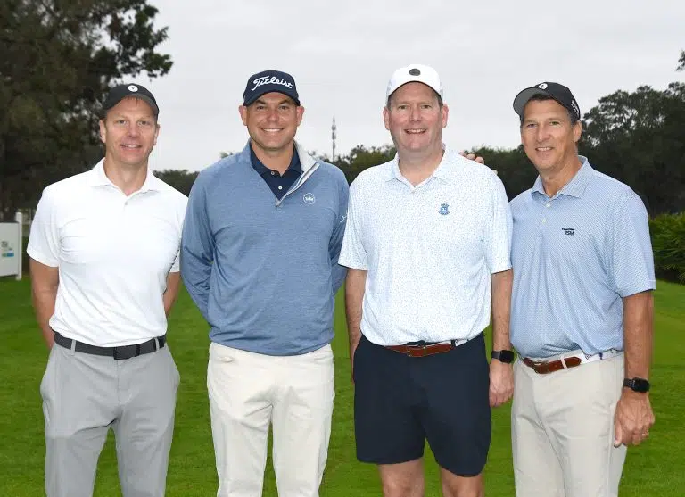 Bill Haas et al. posing for a photo