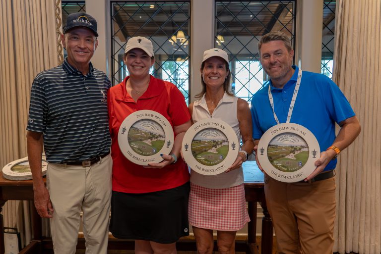 Davis Love III et al. posing for a photo