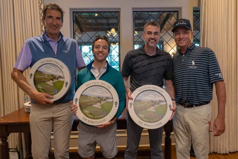 Davis Love III et al. posing for a photo