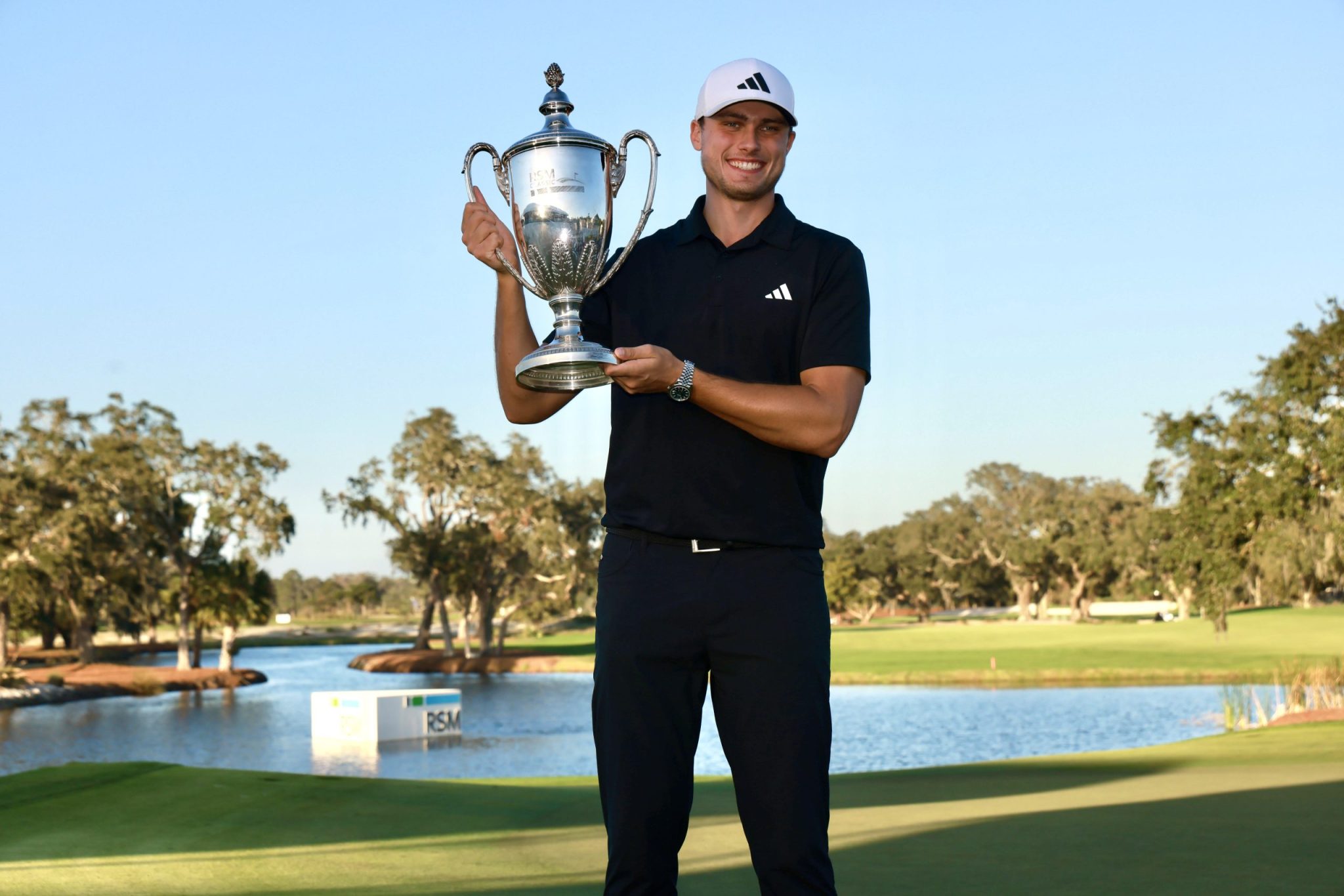 a man holding a golf club